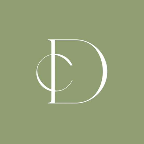 Serif DC monogram in white on sage green