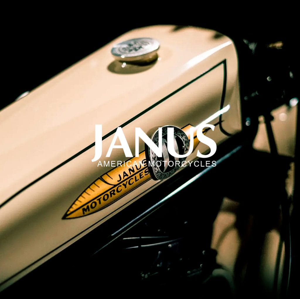 Janus American Motorcycles wordmark over a close-up of a cream hand-painted fuel tank