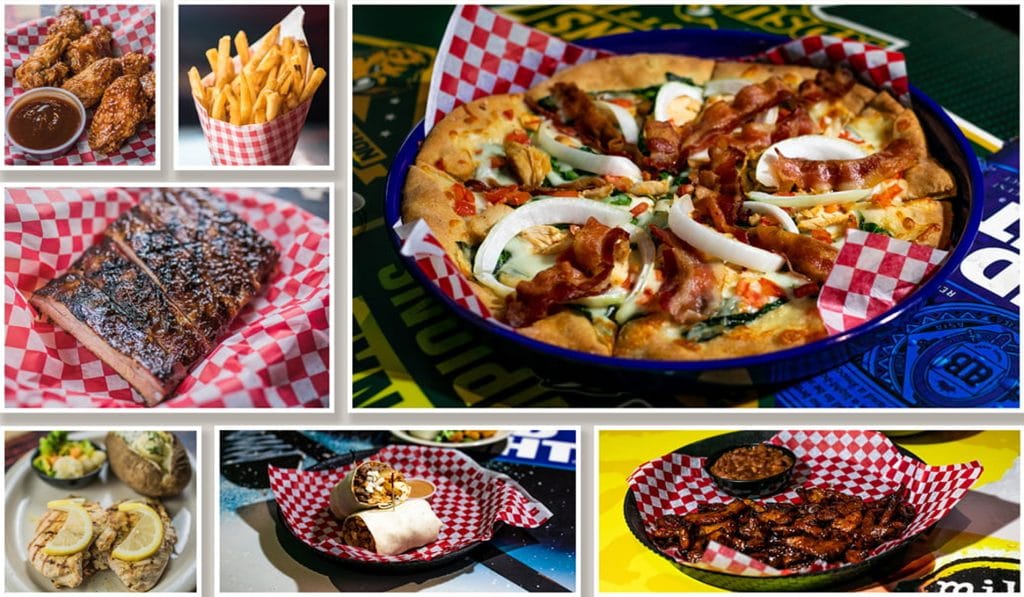Restaurant food photography: pizza, barbecue ribs, wings, fries and a burrito in checkered baskets