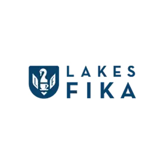 Lakes Fika logo with a shield holding a coffee cup and wheat