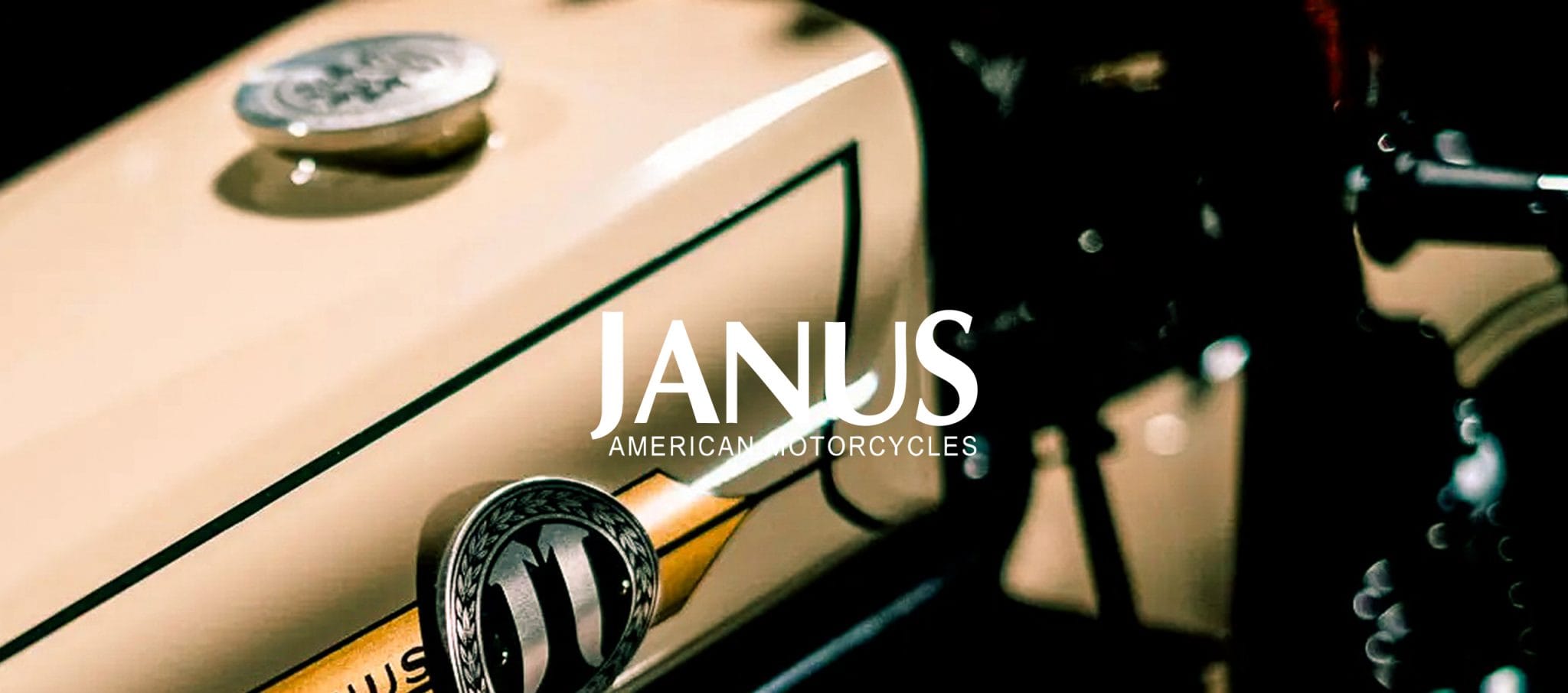 Janus American Motorcycles banner over a close-up of a cream hand-painted fuel tank