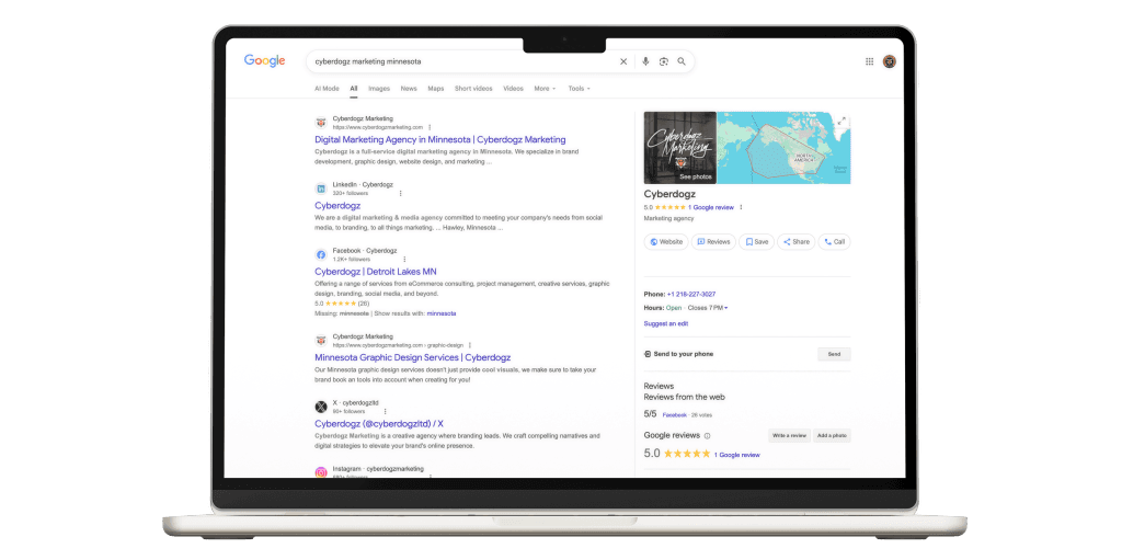 Google results for cyberdogz marketing minnesota on a laptop, with the Business Profile panel alongside